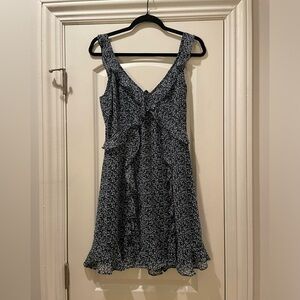 Boutique floral ruffle mini dress with open back